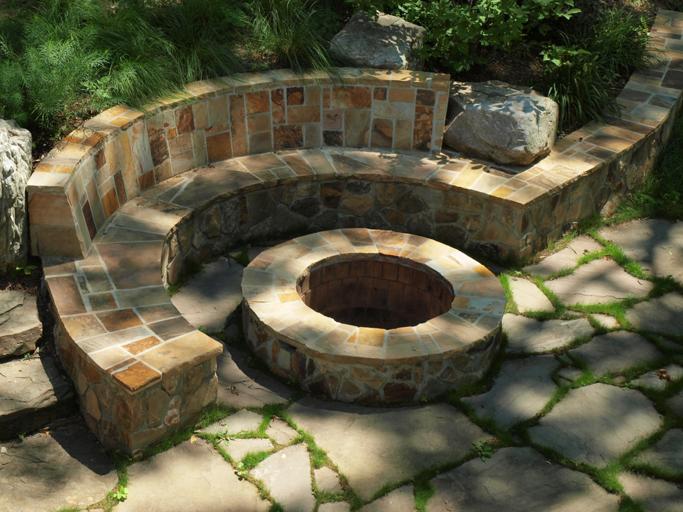 Design ideas for a medium sized contemporary back partial sun garden in Other with a fire feature and natural stone paving.