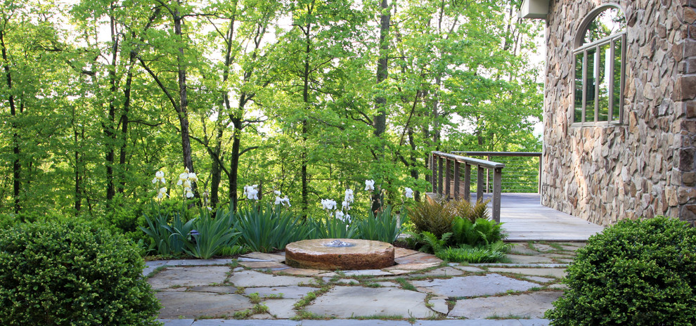 Design ideas for a mid-sized contemporary partial sun backyard stone garden path in Other.