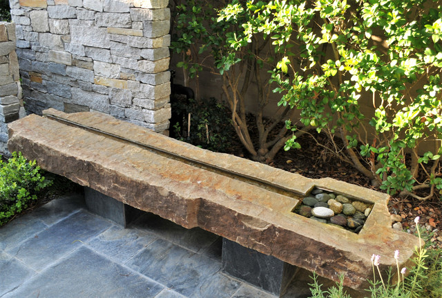 Image of Stone patio bench with fountain