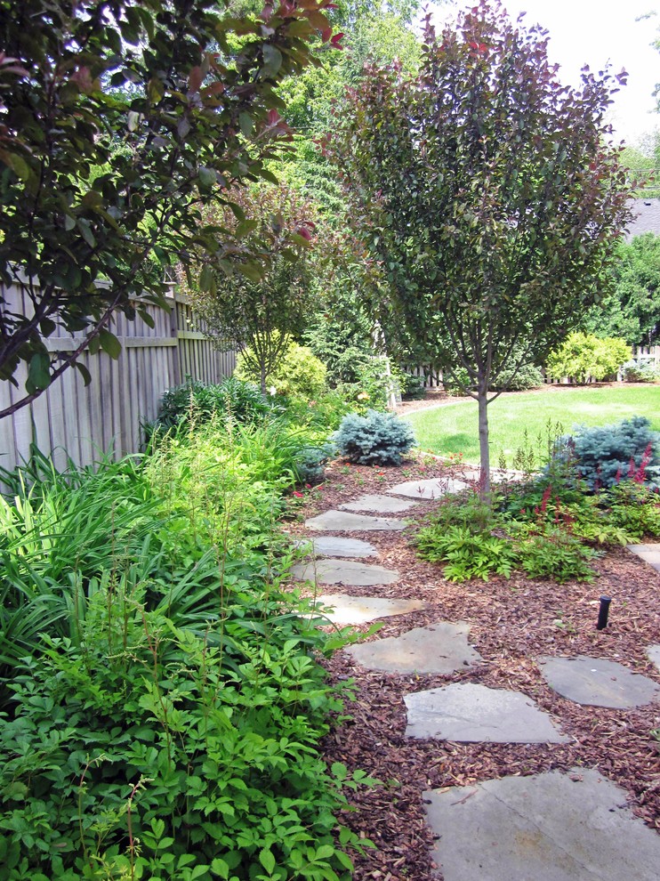 Inspiration for a classic back garden fence in Minneapolis with natural stone paving.
