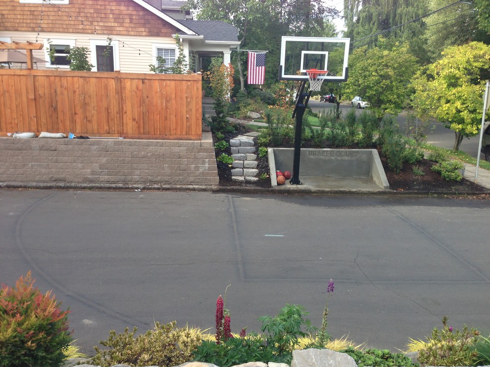 Design ideas for a large traditional front partial sun garden in Portland with an outdoor sport court.