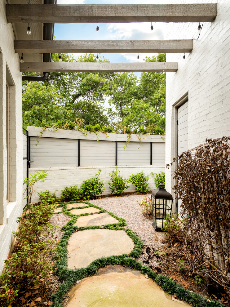 This is an example of a partial sun courtyard stone landscaping in Dallas for spring.