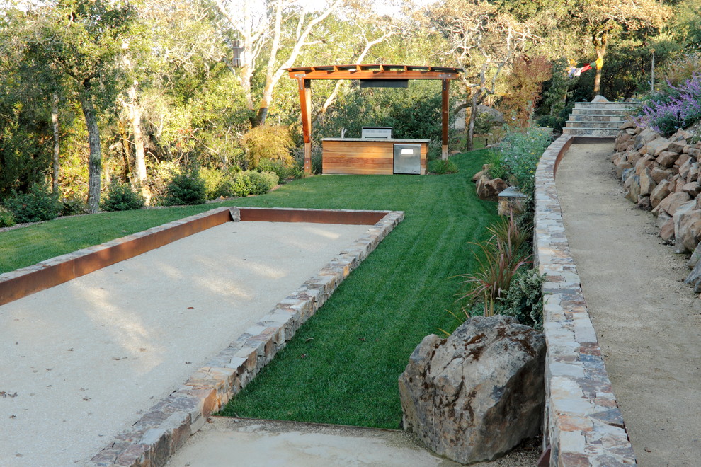 Design ideas for a large mediterranean sloped partial sun garden for summer in San Francisco with decomposed granite.