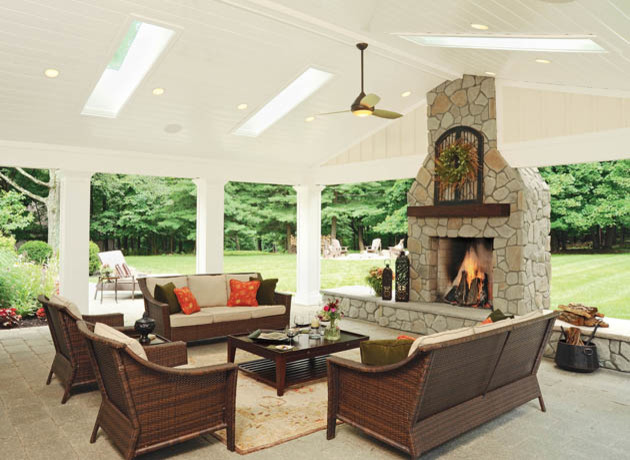 Design ideas for an expansive classic back full sun garden for autumn in Columbus with a fire feature and brick paving.