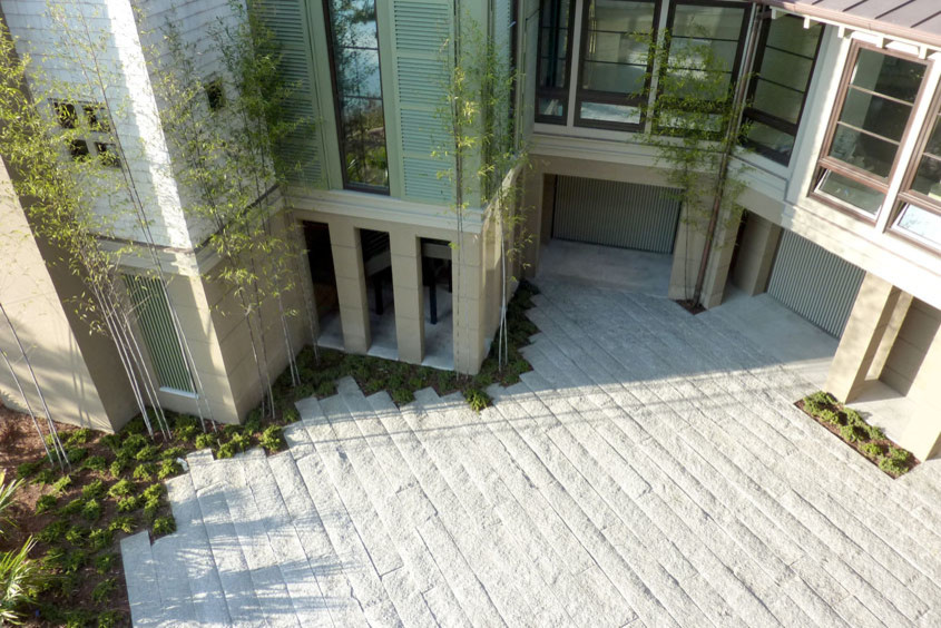 Inspiration for a contemporary courtyard stone landscaping in Charleston.