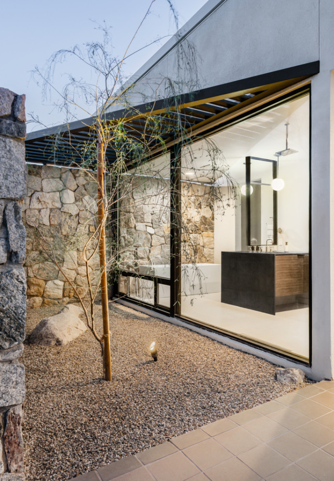 Foto di un giardino minimalista esposto a mezz'ombra di medie dimensioni e dietro casa con ghiaia