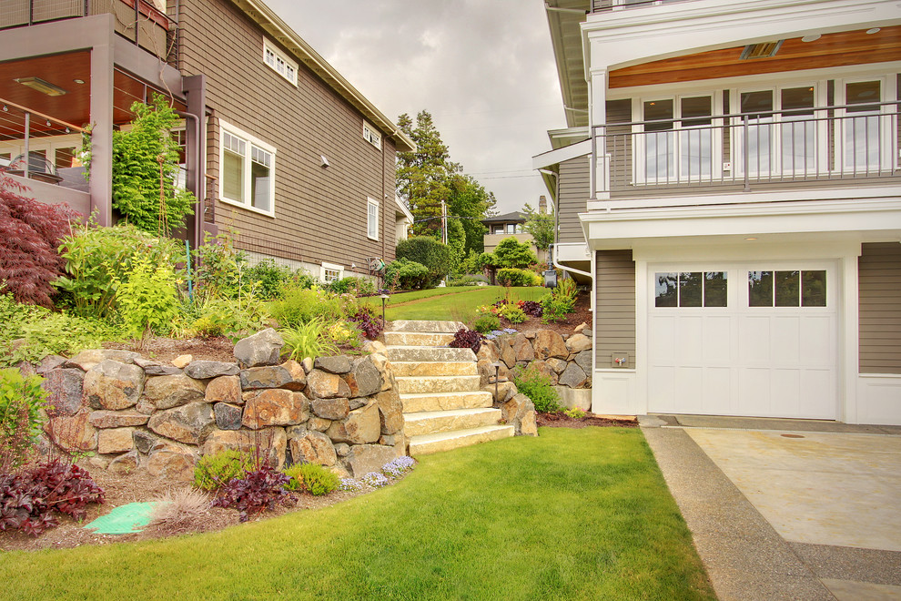 Design ideas for a large craftsman side yard retaining wall landscape in Seattle.