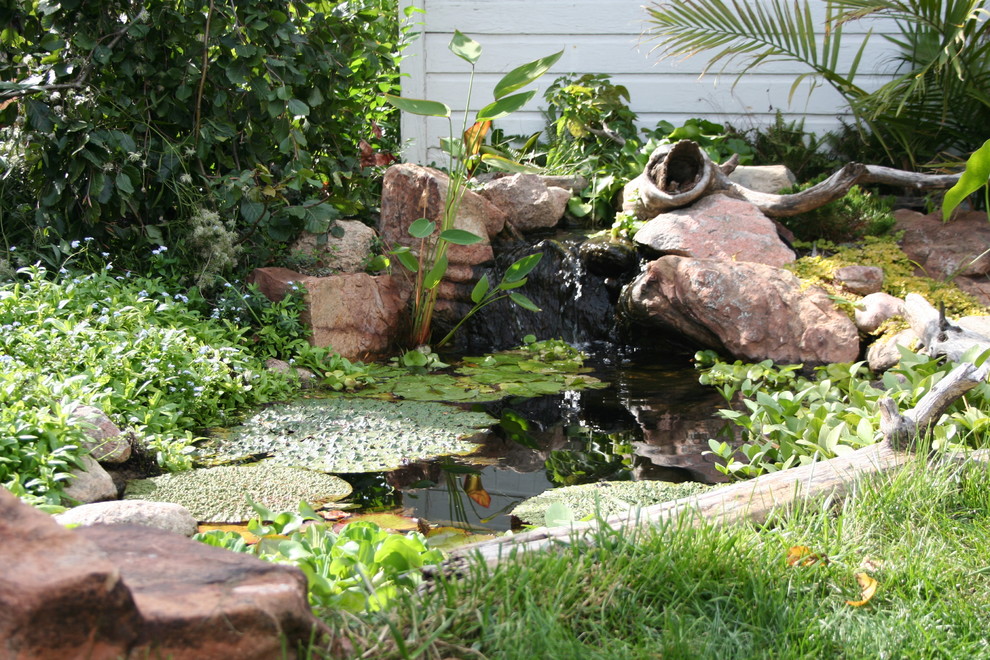 This is an example of a large rustic water fountain landscape in Omaha.
