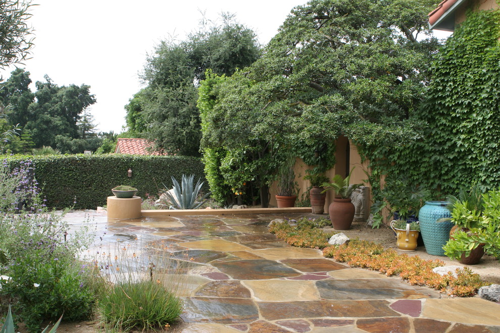 This is an example of a huge mediterranean drought-tolerant and full sun front yard stone garden path in Los Angeles.