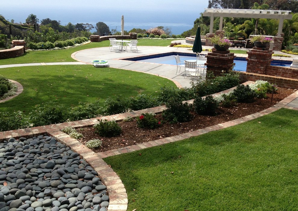 This is an example of a huge eclectic backyard landscaping in San Diego.