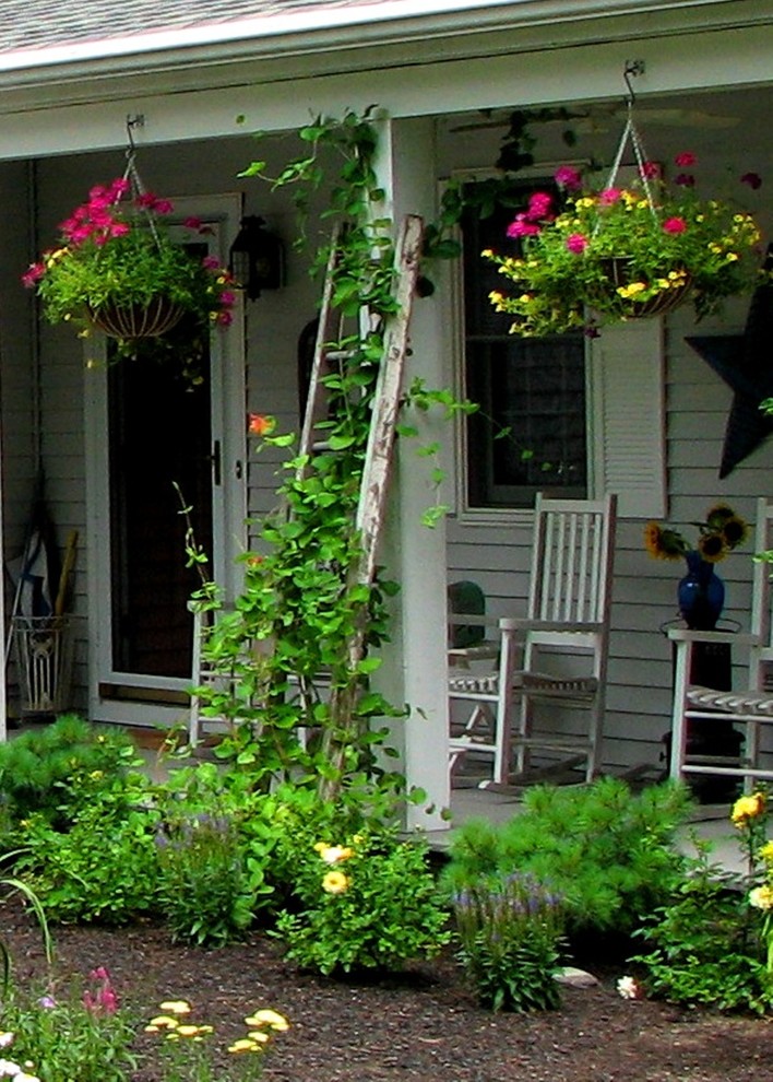 Photo of a rustic partial sun front yard landscaping in Boston for summer.