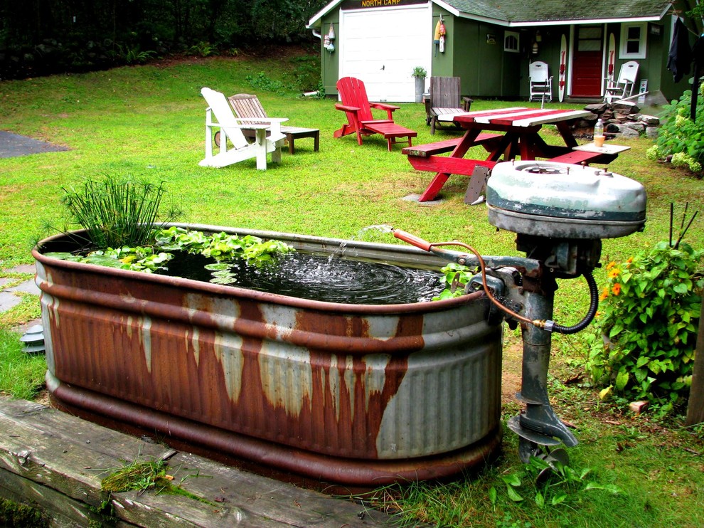This is an example of a rustic backyard water fountain landscape in Providence for summer.