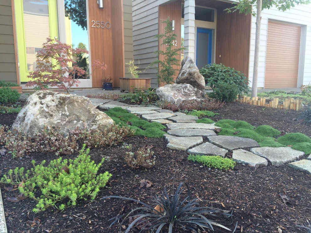 This is an example of a small front yard stone landscaping in Portland.