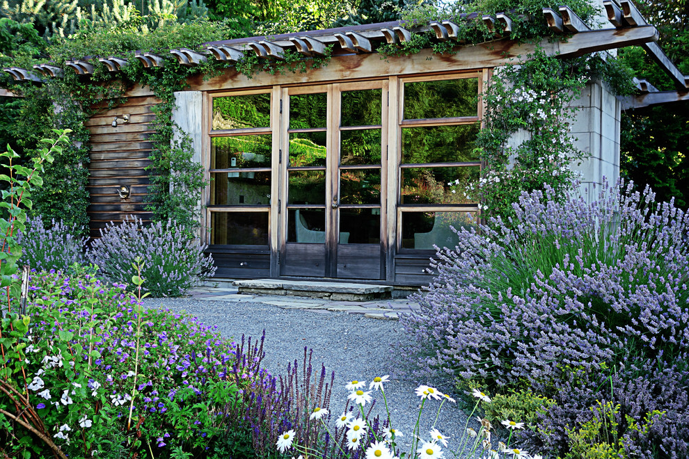 Inspiration for a large traditional full sun backyard gravel formal garden in Seattle for spring.