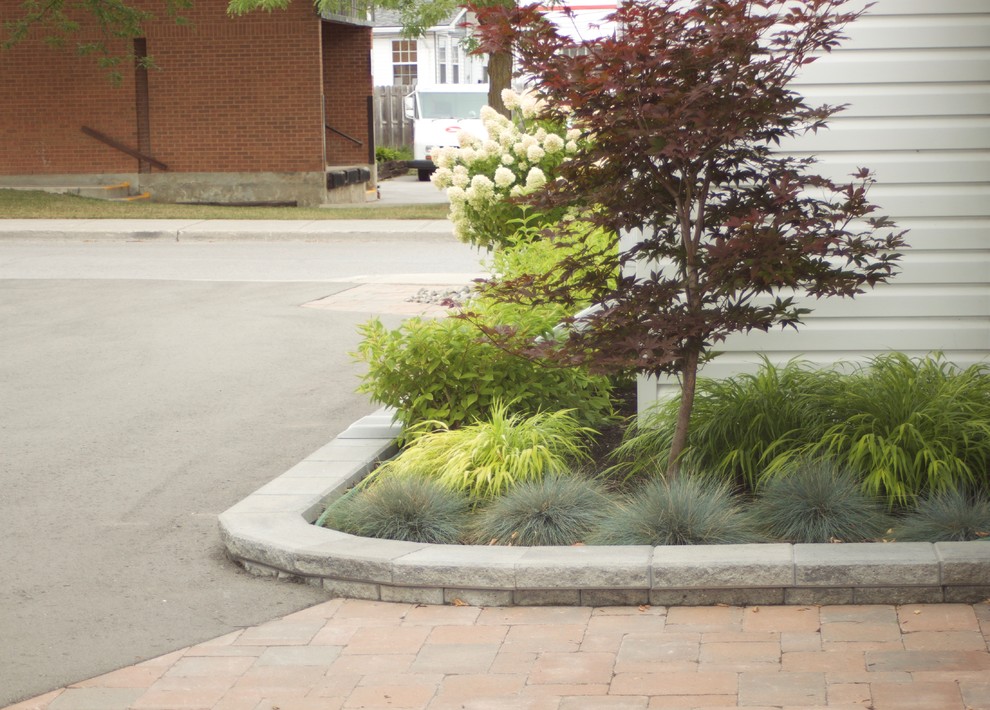 Lakefield, historical home with walkways and flower beds Midcentury