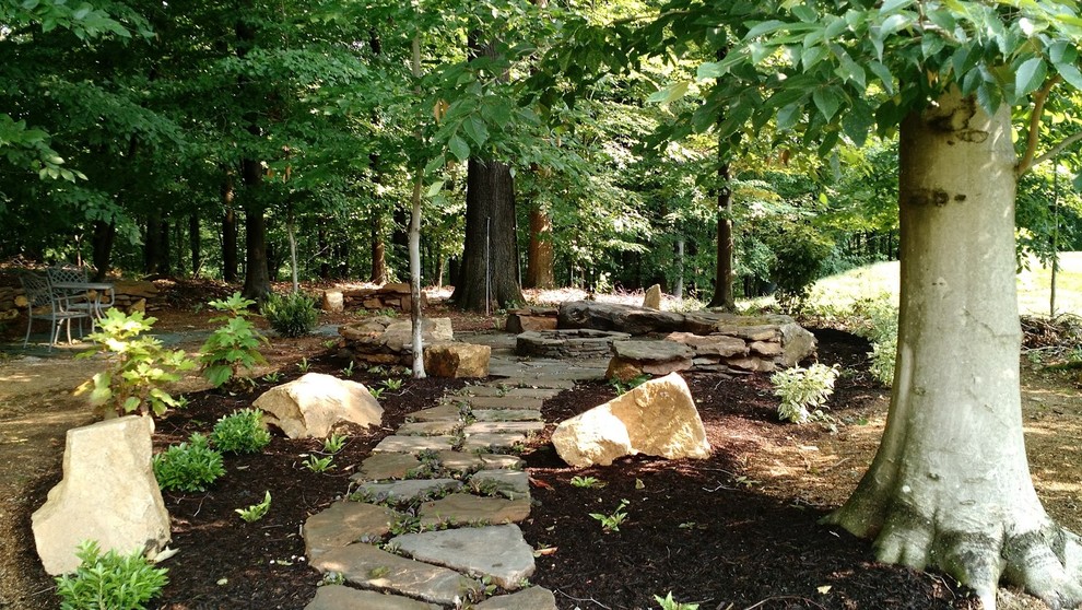 Photo of a mid-sized rustic shade backyard stone garden path in Philadelphia for summer.