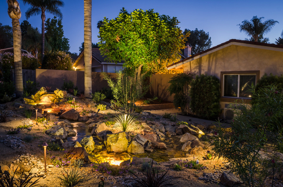 Design ideas for a medium sized front full sun garden in San Diego with a water feature.