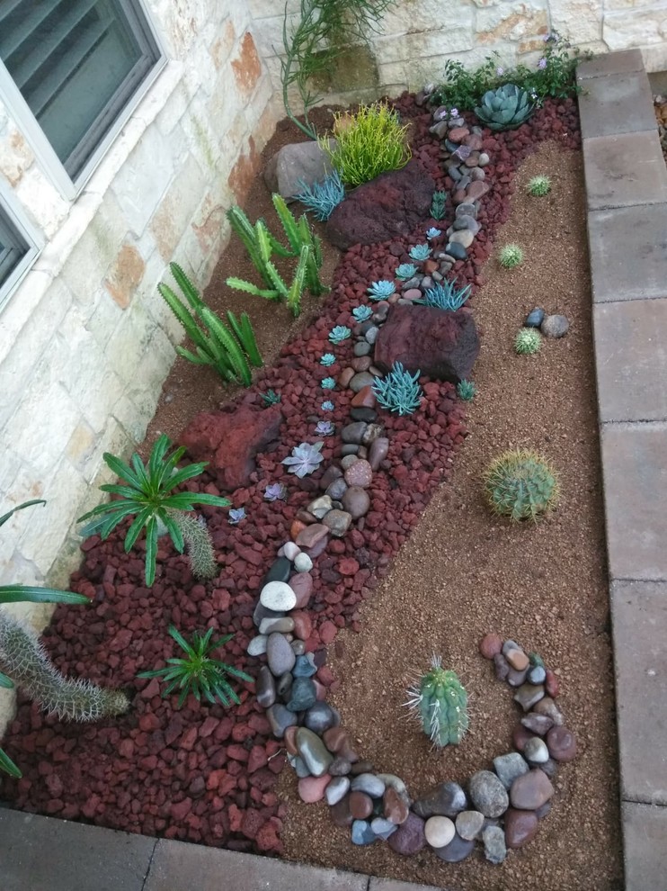 Photo of a mid-sized southwestern partial sun front yard concrete paver landscaping in Houston for spring.