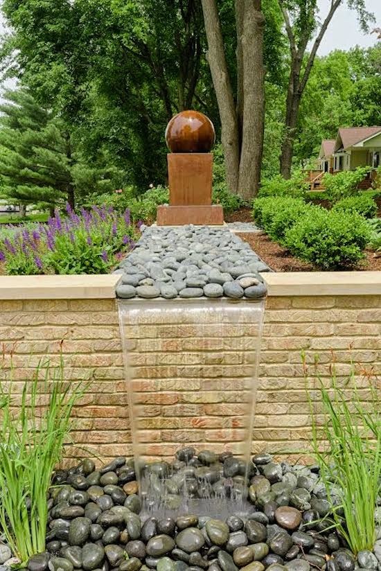 Design ideas for a large traditional partial sun front yard water fountain landscape in Chicago.