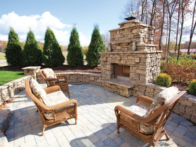 Design ideas for a large traditional back full sun garden in Other with brick paving.