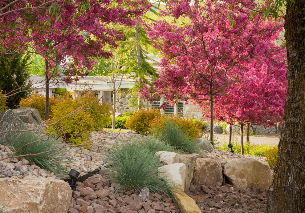 Inspiration for a large traditional drought-tolerant and full sun front yard gravel landscaping in Salt Lake City for spring.