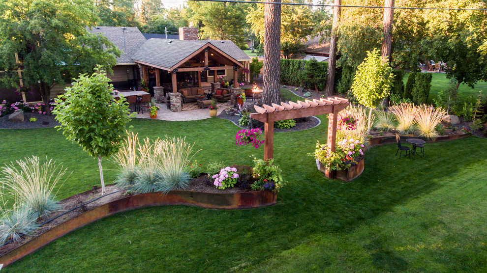 This is an example of a mid-sized rustic partial sun backyard brick landscaping in Seattle.