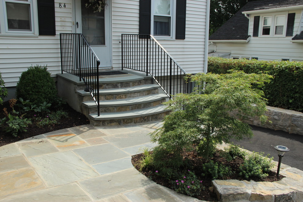 Inspiration for a mid-sized traditional full sun front yard concrete paver landscaping in New York for summer.