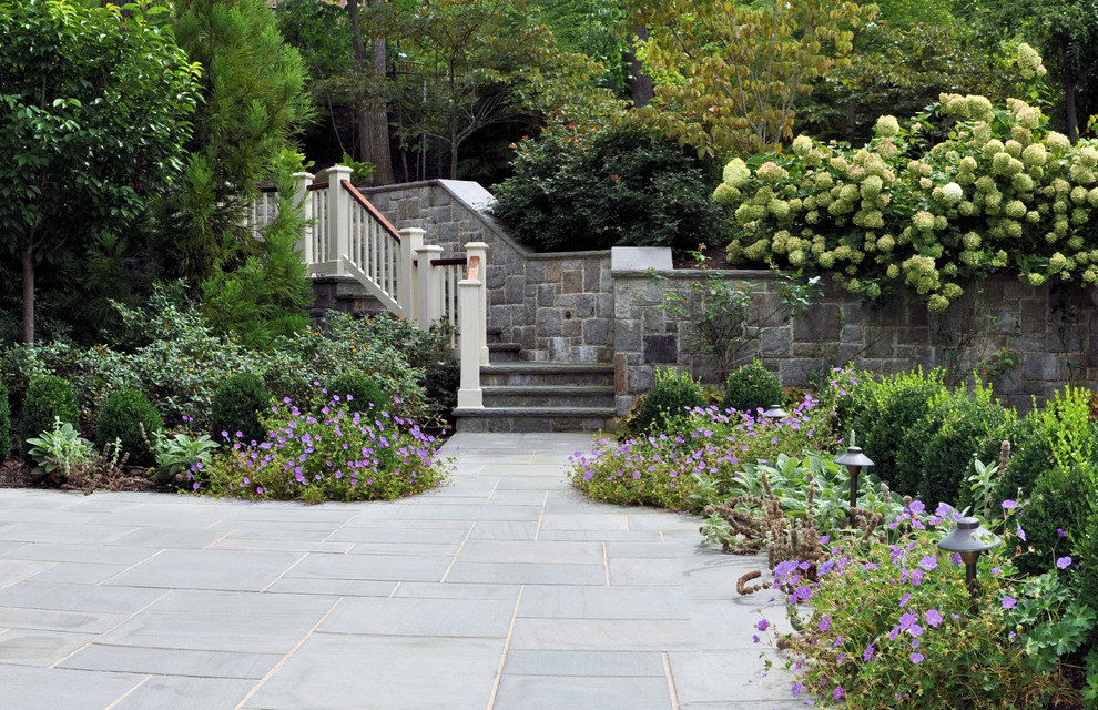 Traditional garden steps in New York with natural stone paving.