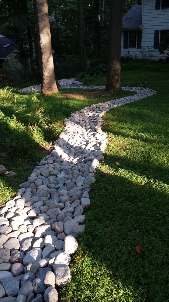 Landscaping And River Rock Drainage Swale Traditional Landscape Philadelphia By Dreamwork Home Improvements Houzz - How To Build A River Rock Patio