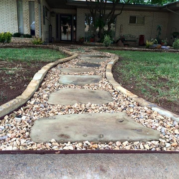 Photo of a medium sized classic front partial sun garden in Oklahoma City with natural stone paving.