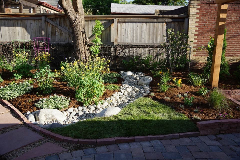 Design ideas for a mid-sized traditional full sun front yard concrete paver landscaping in Denver for spring.