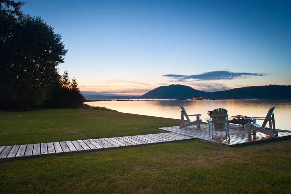 Inspiration for a traditional backyard landscaping in Vancouver with decking.