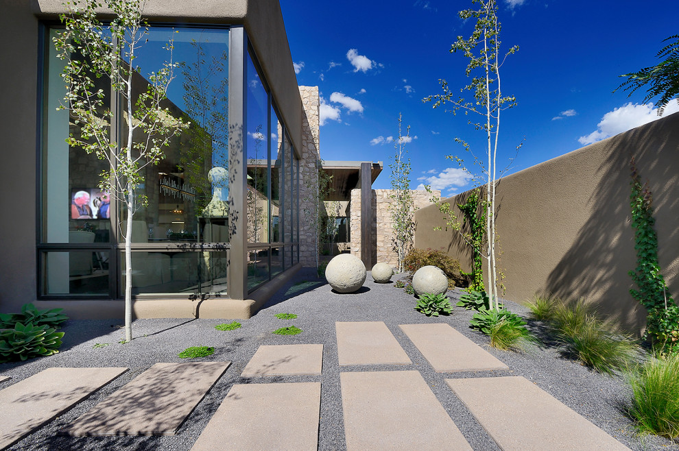 Design ideas for a large southwestern desert and full sun backyard gravel outdoor sport court in Albuquerque.