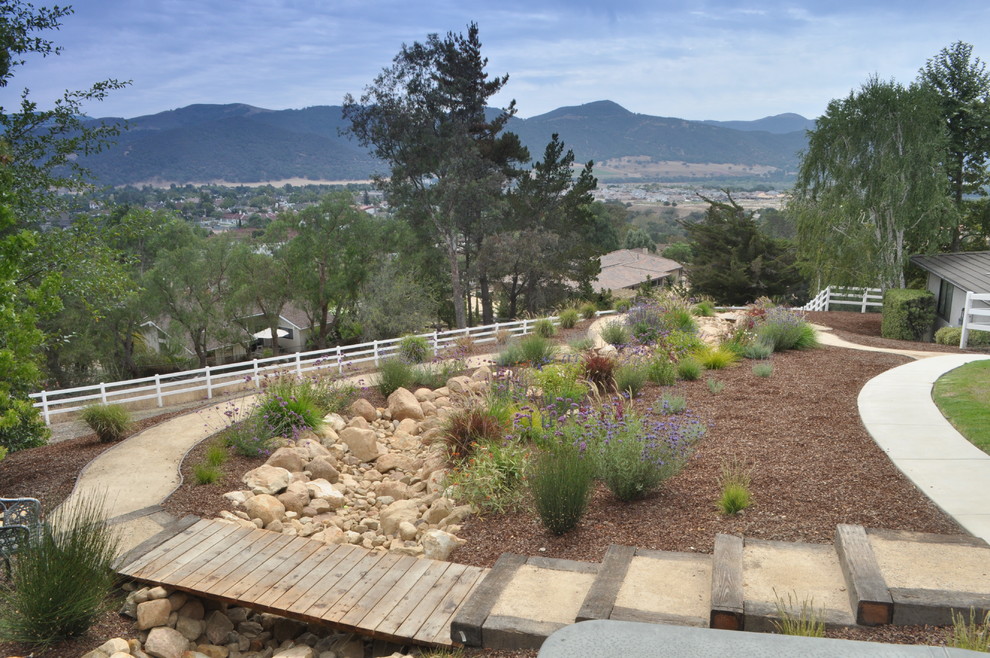 Design ideas for a large rustic drought-tolerant and full sun backyard gravel garden path in Santa Barbara for spring.