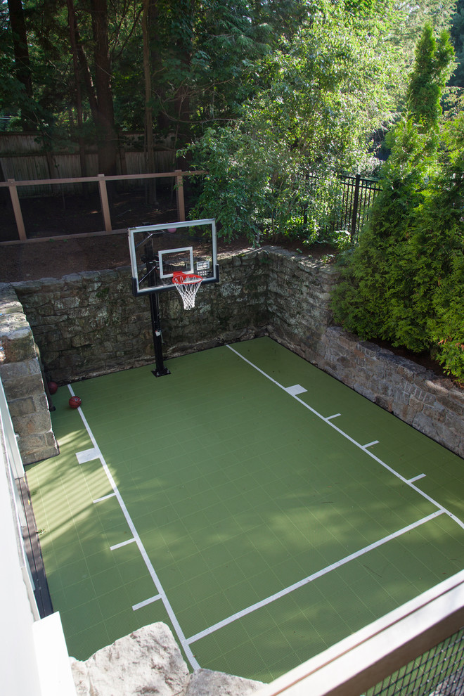 Photo of a traditional back garden in Boston with an outdoor sport court.