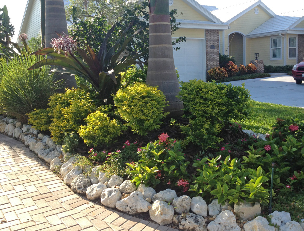 Layered flower beds Beach Style Landscape Tampa by Siobhan's