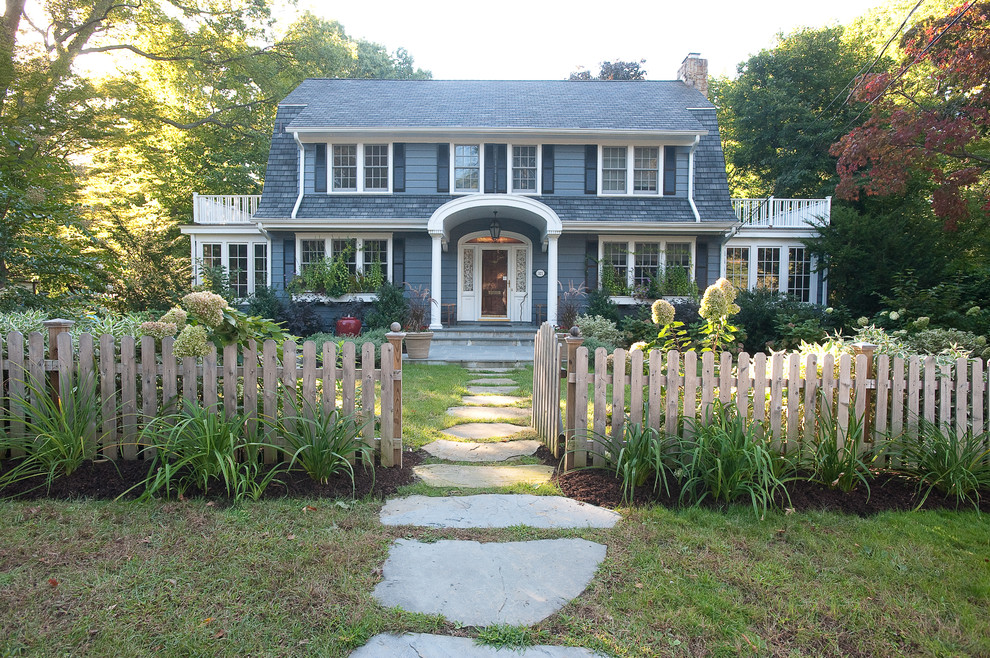 Inspiration for a traditional shade front yard stone landscaping in New York.