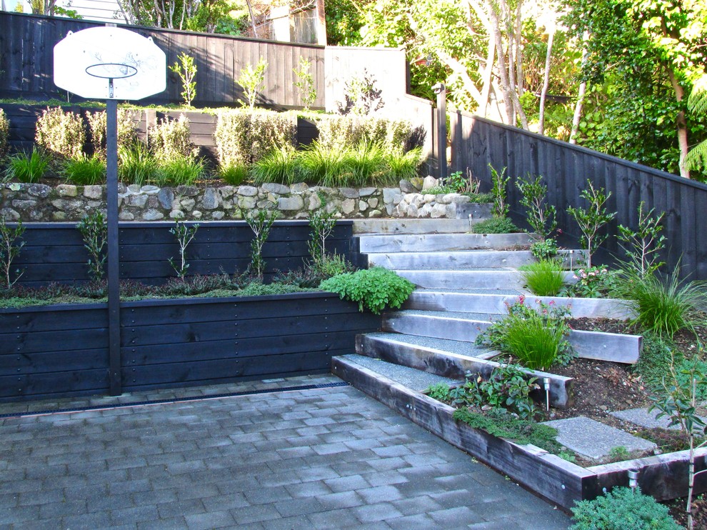 Small rustic garden in Wellington with a retaining wall.