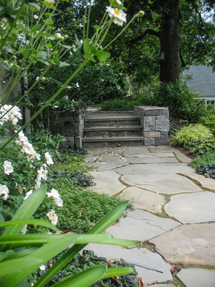 Inspiration for a rustic partial sun stone retaining wall landscape in Boston.