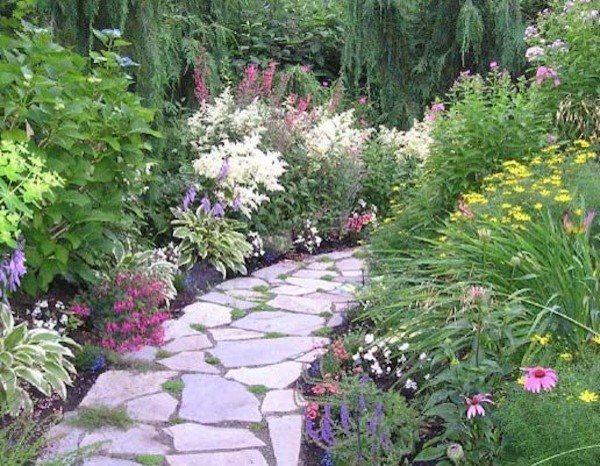 Inspiration for a contemporary back partial sun garden in Seattle with a garden path and natural stone paving.