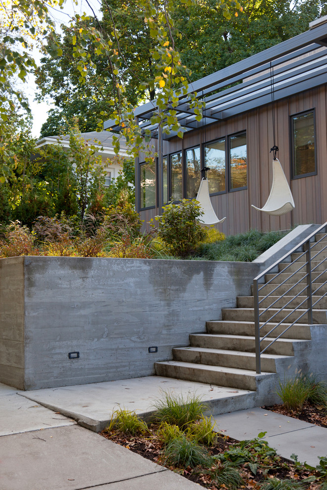 Modelo de jardín contemporáneo con muro de contención