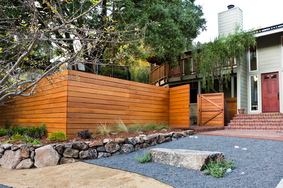 Design ideas for a medium sized modern front xeriscape partial sun garden in San Francisco with a garden path and gravel.