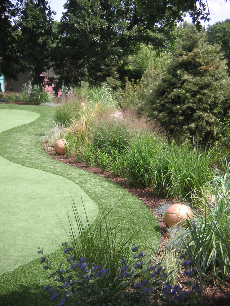 Inspiration for a large contemporary full sun backyard mulch garden path in Denver for spring.