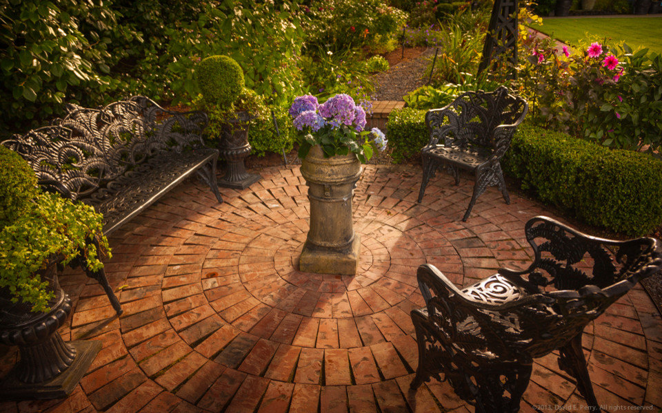 Inspiration for a large traditional backyard brick formal garden in Seattle.