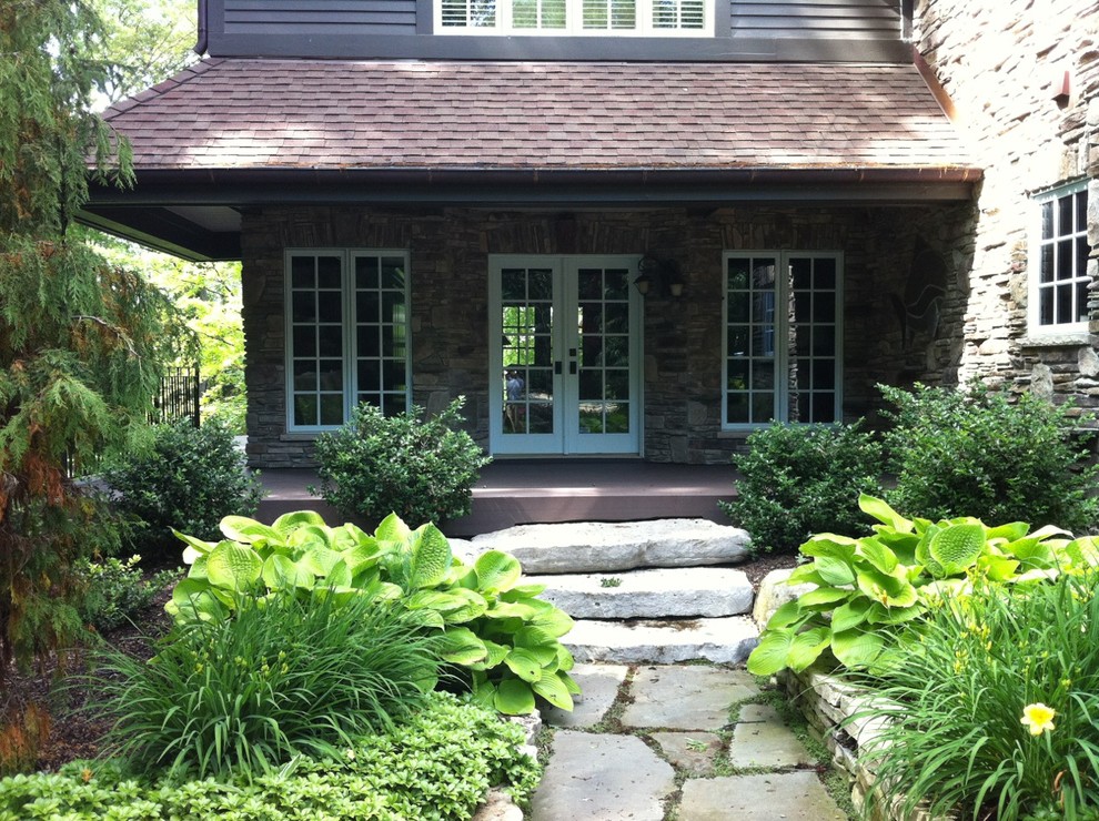 Photo of a large traditional shade front yard stone garden path in St Louis for spring.