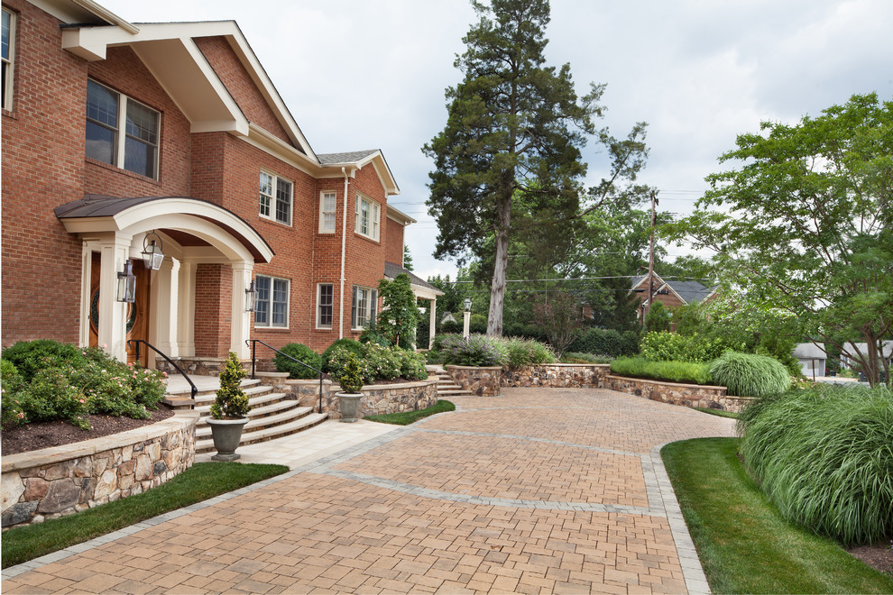 Inspiration for a traditional front garden in DC Metro with brick paving.