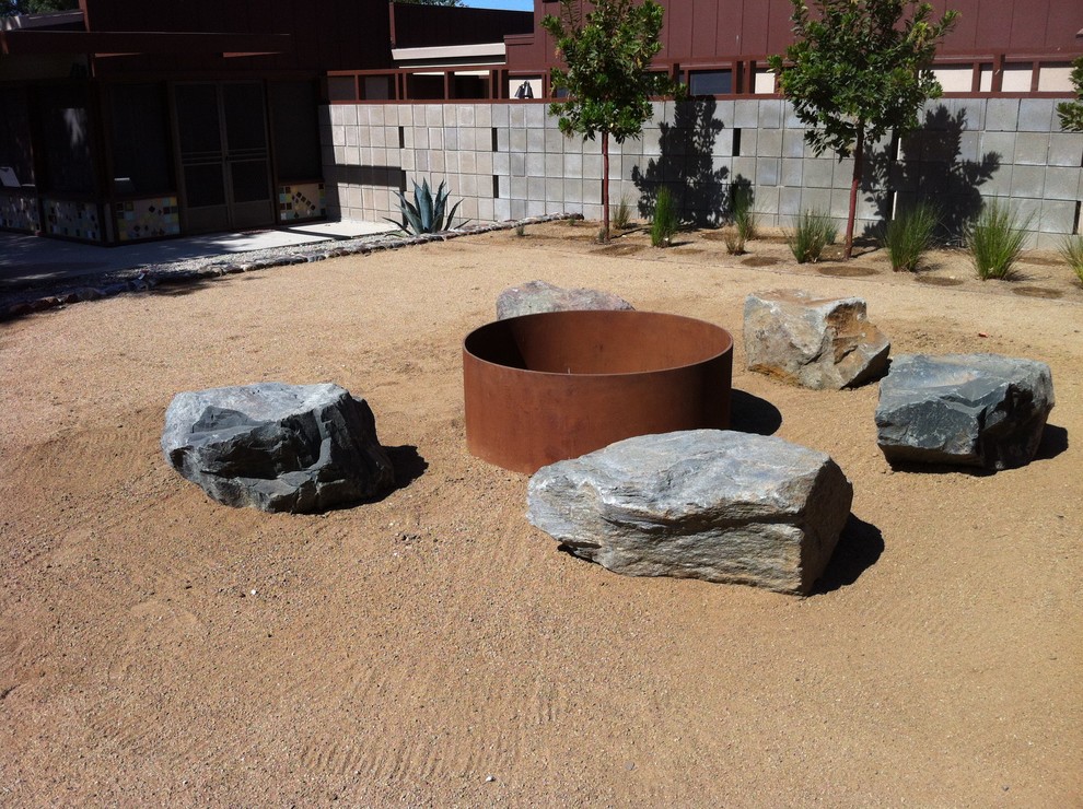 Inspiration for a contemporary backyard landscaping in Santa Barbara with a fire pit.