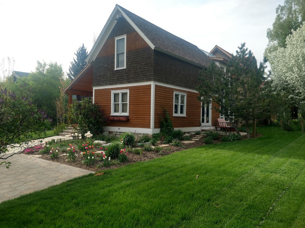 Medium sized traditional back garden in Denver with natural stone paving.