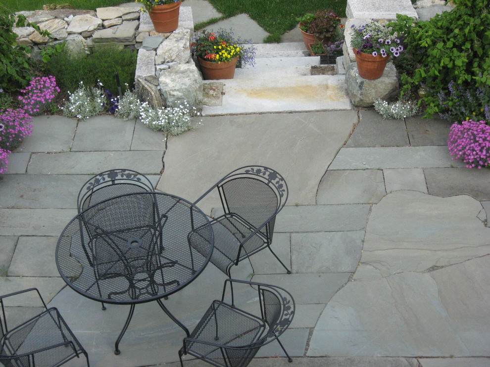 Inspiration for a small eclectic back partial sun garden for summer in Boston with natural stone paving.