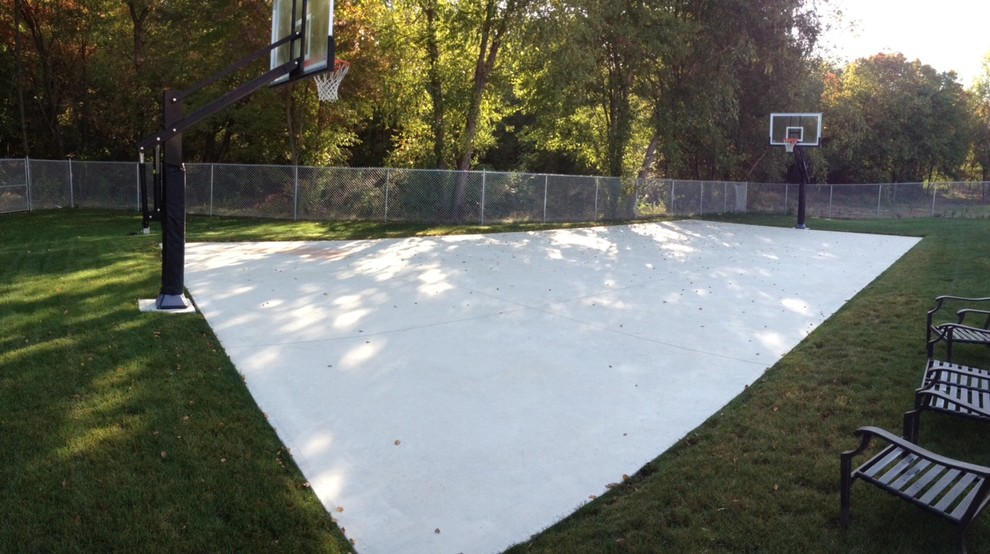 Photo of a large traditional back partial sun garden in Cleveland with an outdoor sport court.